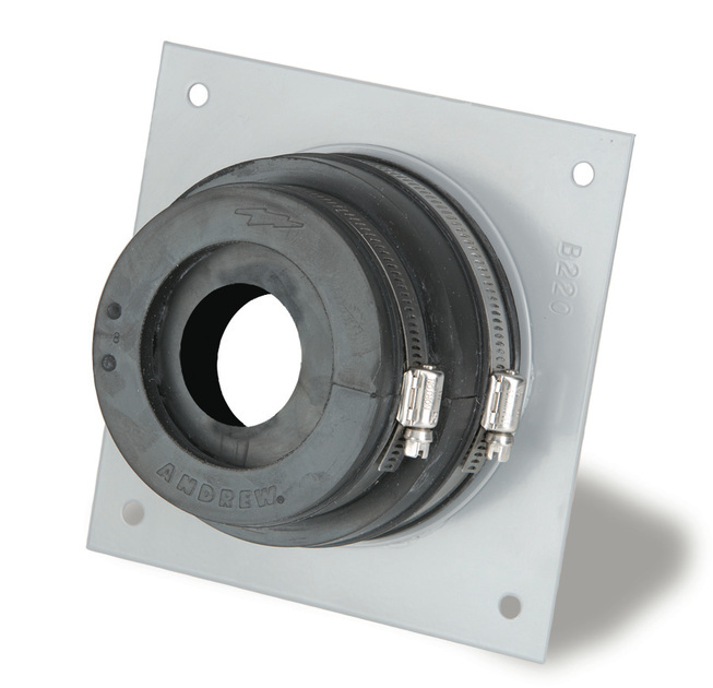 7000-00753423_com_01.jpg Rundes Dichtungselement aus Gummi, befestigt auf Metallplatte.