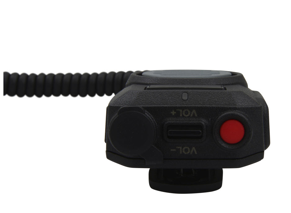 Close-up of a radio with volume control and red button.