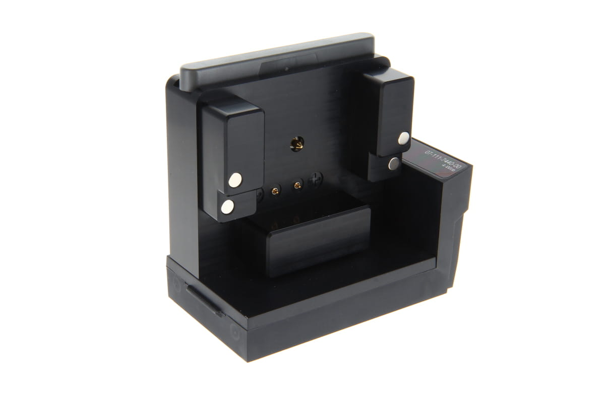 Black electronic charging dock with magnetic contacts.