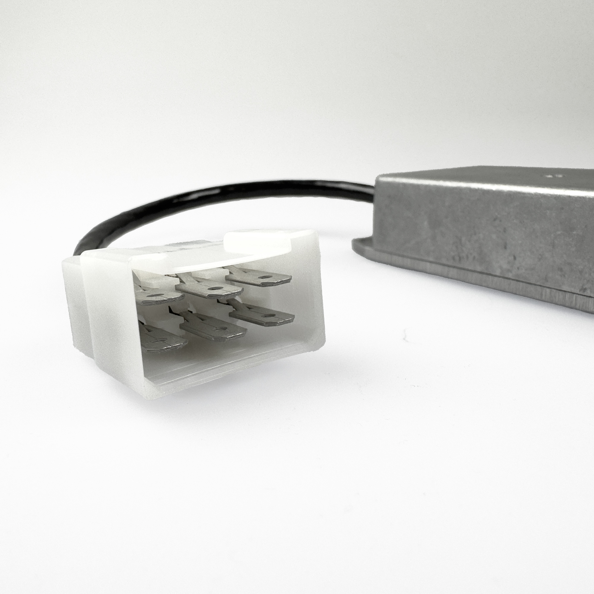 Close-up of a connector with cable and metal housing.