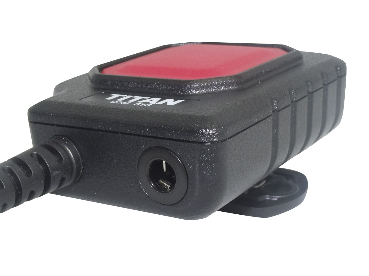 Black electronic device with red top, cable slot on the end.