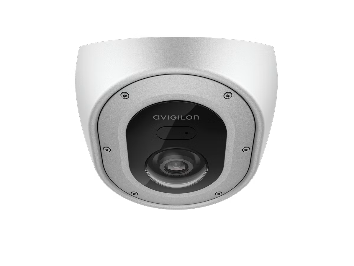 White surveillance camera with black front panel and lens in the center.