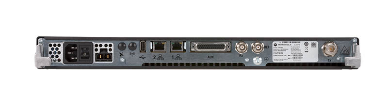 Back of a network device with various ports and power input.