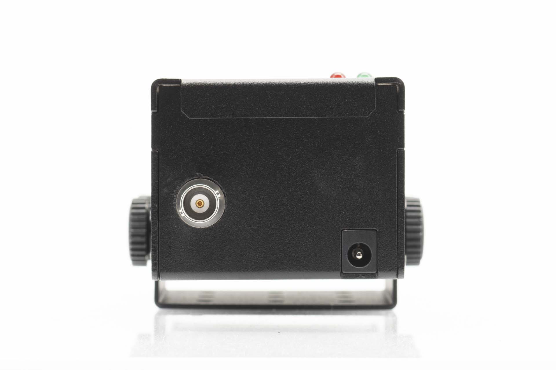 7000-00752964_wem_05.jpg Electronic device with two connectors against white background.